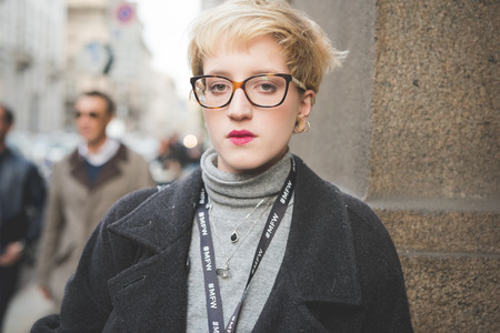 MILAN, ITALY - MARCH 01: People during Milan Fashion week, Italy on March, 01 2015. Eccentric and fashionable people outside city during Milan fashion week wait for models and famous peopleのeditorial素材