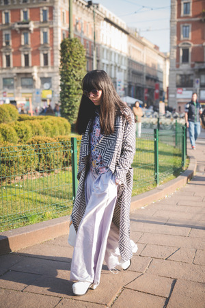 MILAN, ITALY - FEBRUARY 28: People during Milan Fashion week, Italy on February, 28 2015. Eccentric and fashionable people outside city during Milan fashion week wait for models and famous peopleのeditorial素材