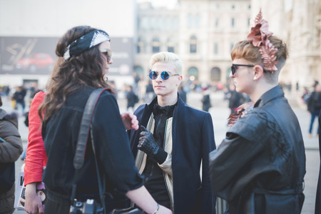 MILAN, ITALY - FEBRUARY 28: People during Milan Fashion week, Italy on February, 28 2015. Eccentric and fashionable people outside city during Milan fashion week wait for models and famous peopleのeditorial素材