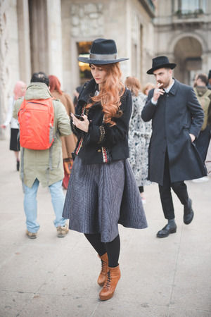 MILAN, ITALY - FEBRUARY 28: People during Milan Fashion week, Italy on February, 28 2015. Eccentric and fashionable people outside city during Milan fashion week wait for models and famous peopleのeditorial素材