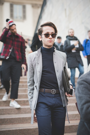 MILAN, ITALY - FEBRUARY 28: People during Milan Fashion week, Italy on February, 28 2015. Eccentric and fashionable people outside city during Milan fashion week wait for models and famous peopleのeditorial素材