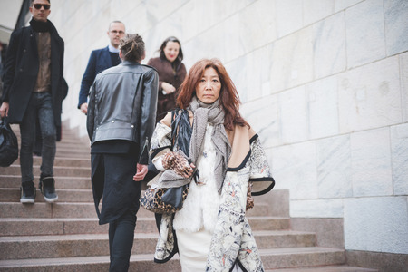 MILAN, ITALY - FEBRUARY 28: People during Milan Fashion week, Italy on February, 28 2015. Eccentric and fashionable people outside city during Milan fashion week wait for models and famous peopleのeditorial素材