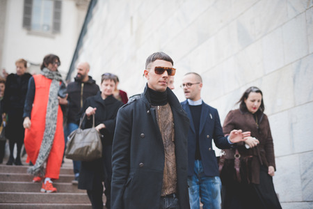 MILAN, ITALY - FEBRUARY 28: People during Milan Fashion week, Italy on February, 28 2015. Eccentric and fashionable people outside city during Milan fashion week wait for models and famous peopleのeditorial素材