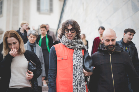 MILAN, ITALY - FEBRUARY 28: People during Milan Fashion week, Italy on February, 28 2015. Eccentric and fashionable people outside city during Milan fashion week wait for models and famous peopleのeditorial素材