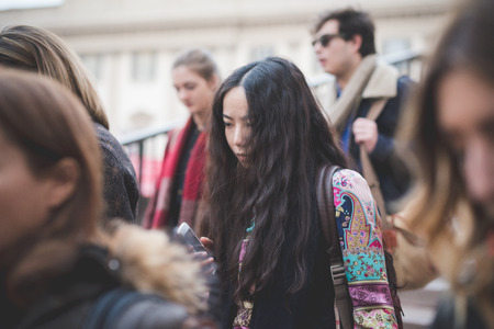 MILAN, ITALY - FEBRUARY 28: People during Milan Fashion week, Italy on February, 28 2015. Eccentric and fashionable people outside city during Milan fashion week wait for models and famous peopleのeditorial素材