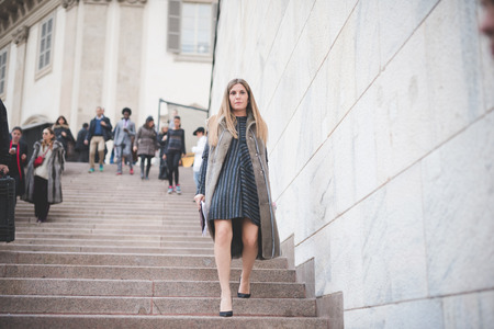 MILAN, ITALY - FEBRUARY 28: People during Milan Fashion week, Italy on February, 28 2015. Eccentric and fashionable people outside city during Milan fashion week wait for models and famous peopleのeditorial素材