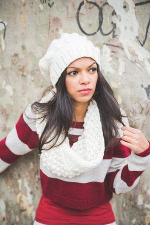 young beautiful indian woman at the park in autumnの写真素材