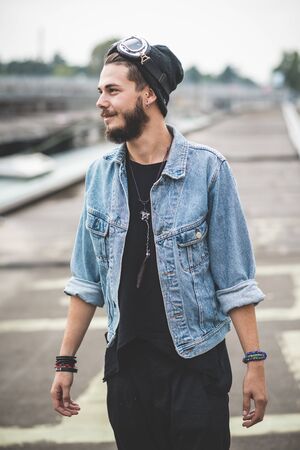 young handsome bearded hipster man in the cityの写真素材