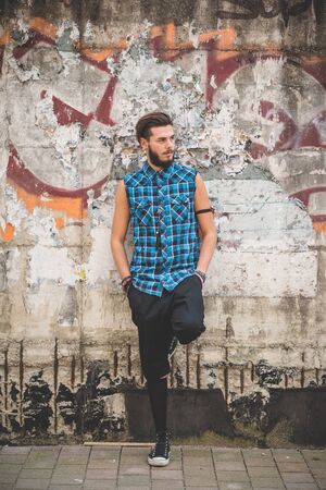young handsome bearded hipster man in the cityの写真素材
