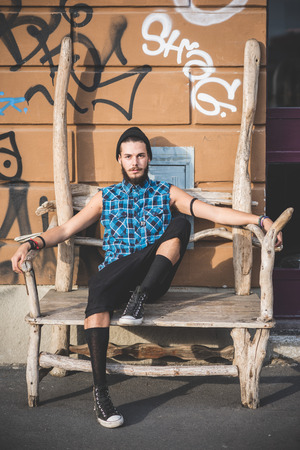 young handsome bearded hipster man in the cityの写真素材