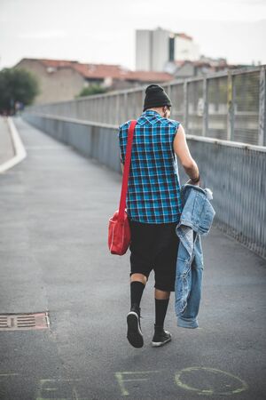 young handsome bearded hipster man in the cityの写真素材