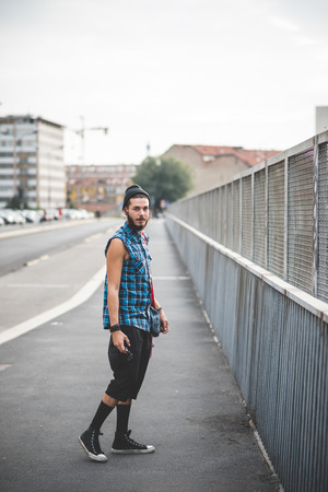 young handsome bearded hipster man in the cityの写真素材