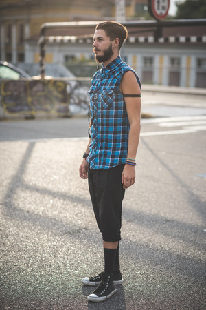 young handsome bearded hipster man in the cityの写真素材