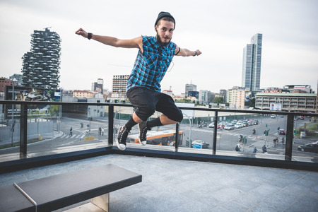 young handsome bearded hipster man in the cityの写真素材