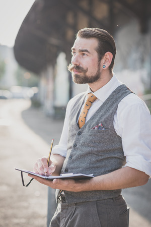 handsome big moustache hipster man in the cityの写真素材