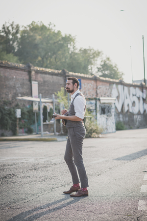 handsome big moustache hipster man playing mandolin in the cityの写真素材