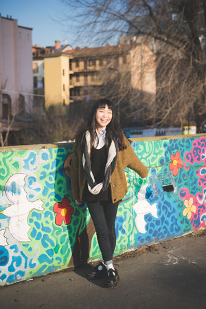 young beautiful asian hipster woman in the cityの写真素材