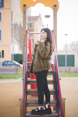 young beautiful asian hipster woman in the cityの写真素材