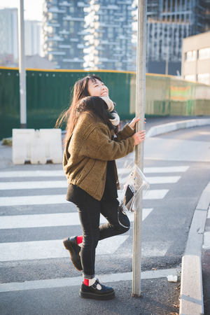 young beautiful asian hipster woman in the cityの写真素材