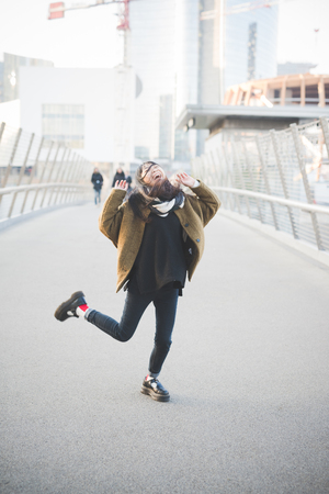 young beautiful asian hipster woman in the cityの写真素材
