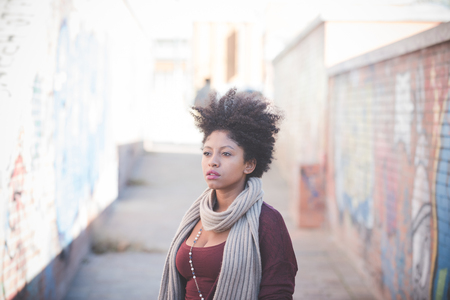 beautiful black curly hair african woman in townの写真素材