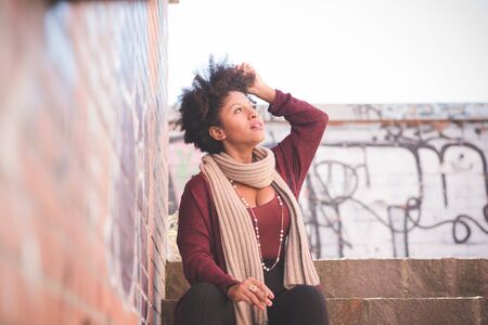 beautiful black curly hair african woman in townの写真素材
