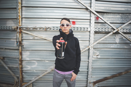 young asian hip hop man in town outdoor lifestyleの写真素材