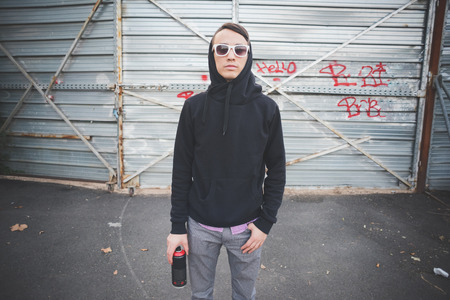young asian hip hop man in town outdoor lifestyleの写真素材