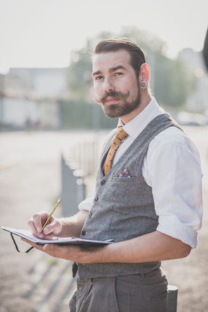 handsome big moustache hipster man in the cityの写真素材