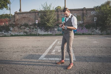 handsome big moustache hipster man playing mandolin in the cityの写真素材