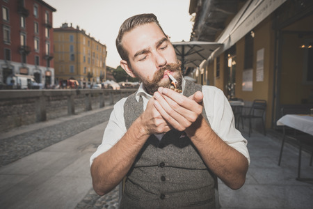 handsome big moustache hipster man in the cityの写真素材