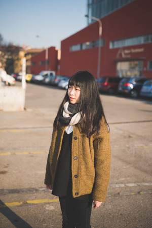 young beautiful asian hipster woman in the cityの写真素材