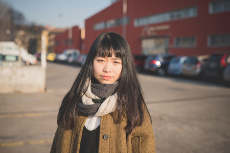 young beautiful asian hipster woman in the cityの写真素材