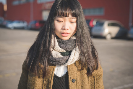 young beautiful asian hipster woman in the cityの写真素材