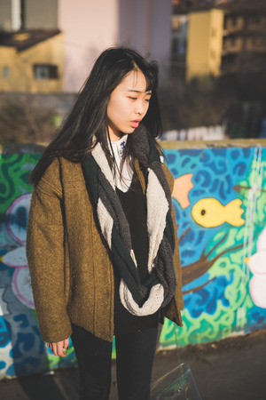 young beautiful asian hipster woman in the cityの写真素材