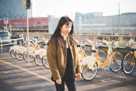 young beautiful asian hipster woman in the cityの写真素材