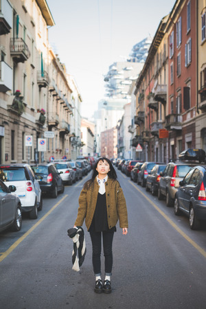 young beautiful asian hipster woman in the cityの写真素材