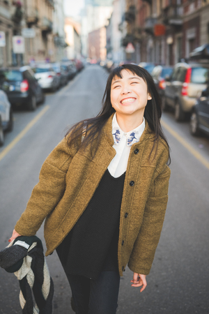 young beautiful asian hipster woman in the cityの写真素材