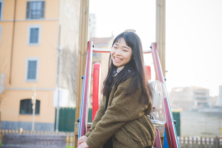 young beautiful asian hipster woman in the cityの写真素材