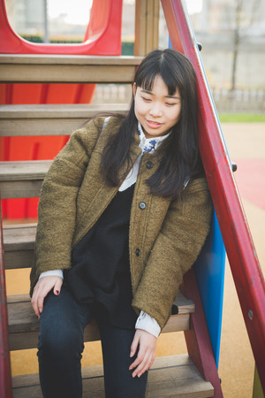 young beautiful asian hipster woman in the cityの写真素材