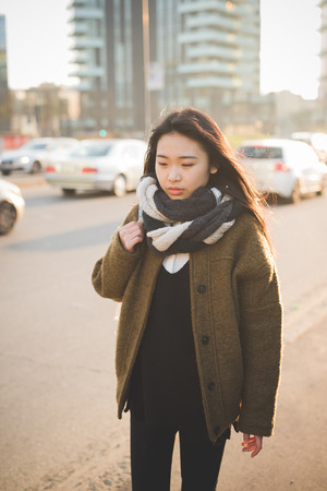 young beautiful asian hipster woman in the cityの写真素材