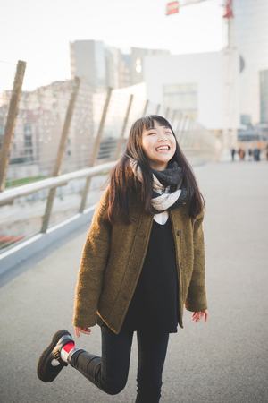 young beautiful asian hipster woman in the cityの写真素材