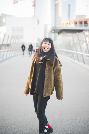 young beautiful asian hipster woman in the cityの写真素材
