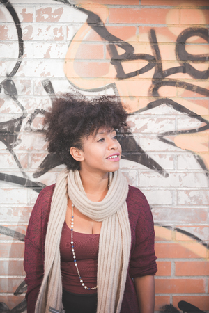 beautiful black curly hair african woman in townの写真素材