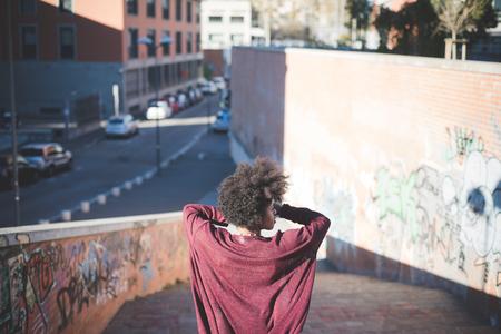 beautiful black curly hair african woman in townの写真素材