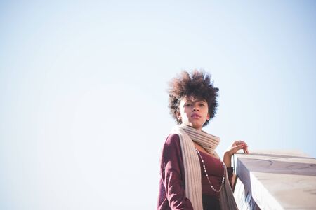 beautiful black curly hair african woman in townの写真素材
