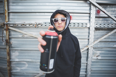 young asian hip hop man in town outdoor lifestyleの写真素材