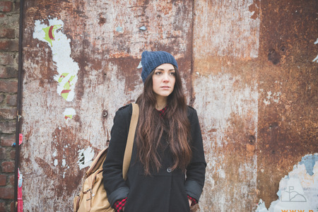 young beautiful long hair model woman living the city in winter outdoor cityの写真素材