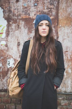 young beautiful long hair model woman living the city in winter outdoor cityの写真素材