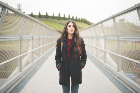young beautiful long hair model woman living the city in winter outdoor cityの写真素材